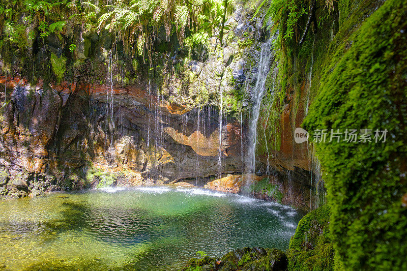 25 Fontes waterfalls in the mountains near Rabaçal and Levada do Risco walkway on Madeira island during a beautiful summer day